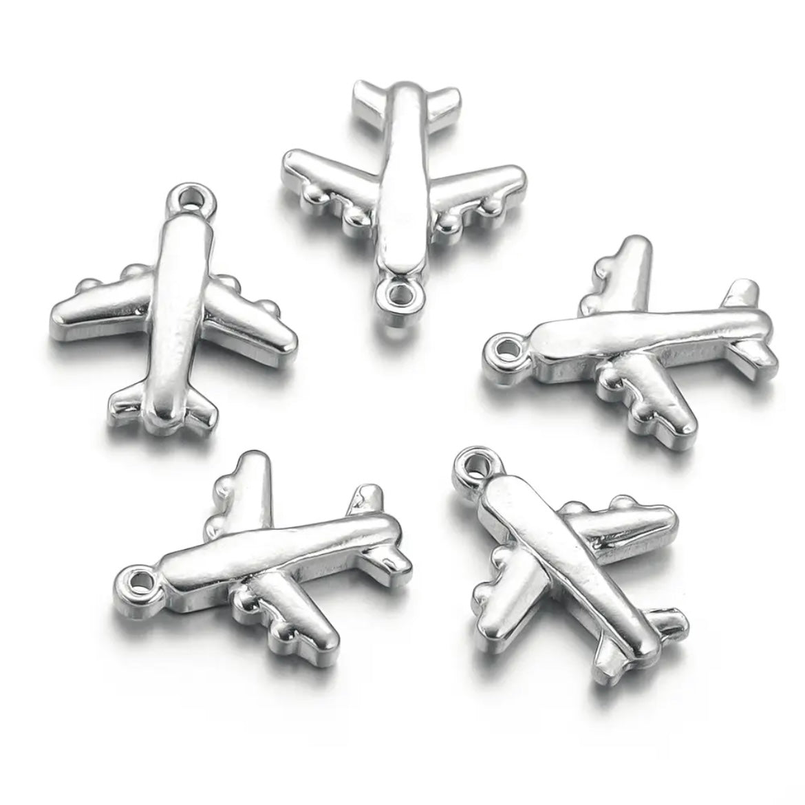 Silver aeroplane charms